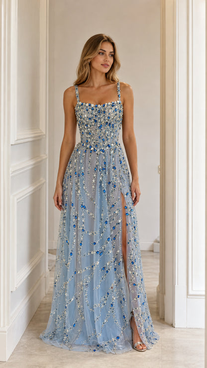 Front view of light blue crystal embellished evening gown with high slit