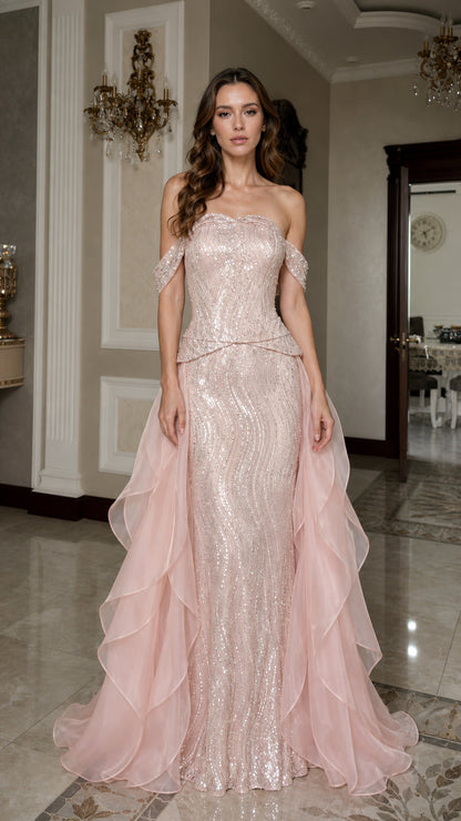 Front view of pink off-shoulder sequin mermaid gown with overskirt