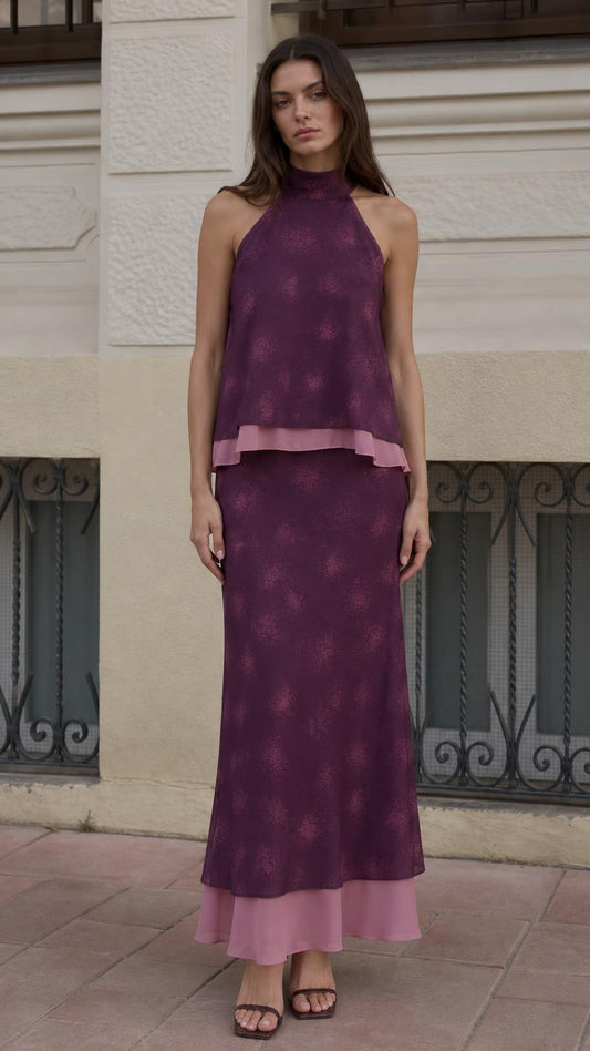 Front view of model wearing purple halter neck top and maxi skirt set