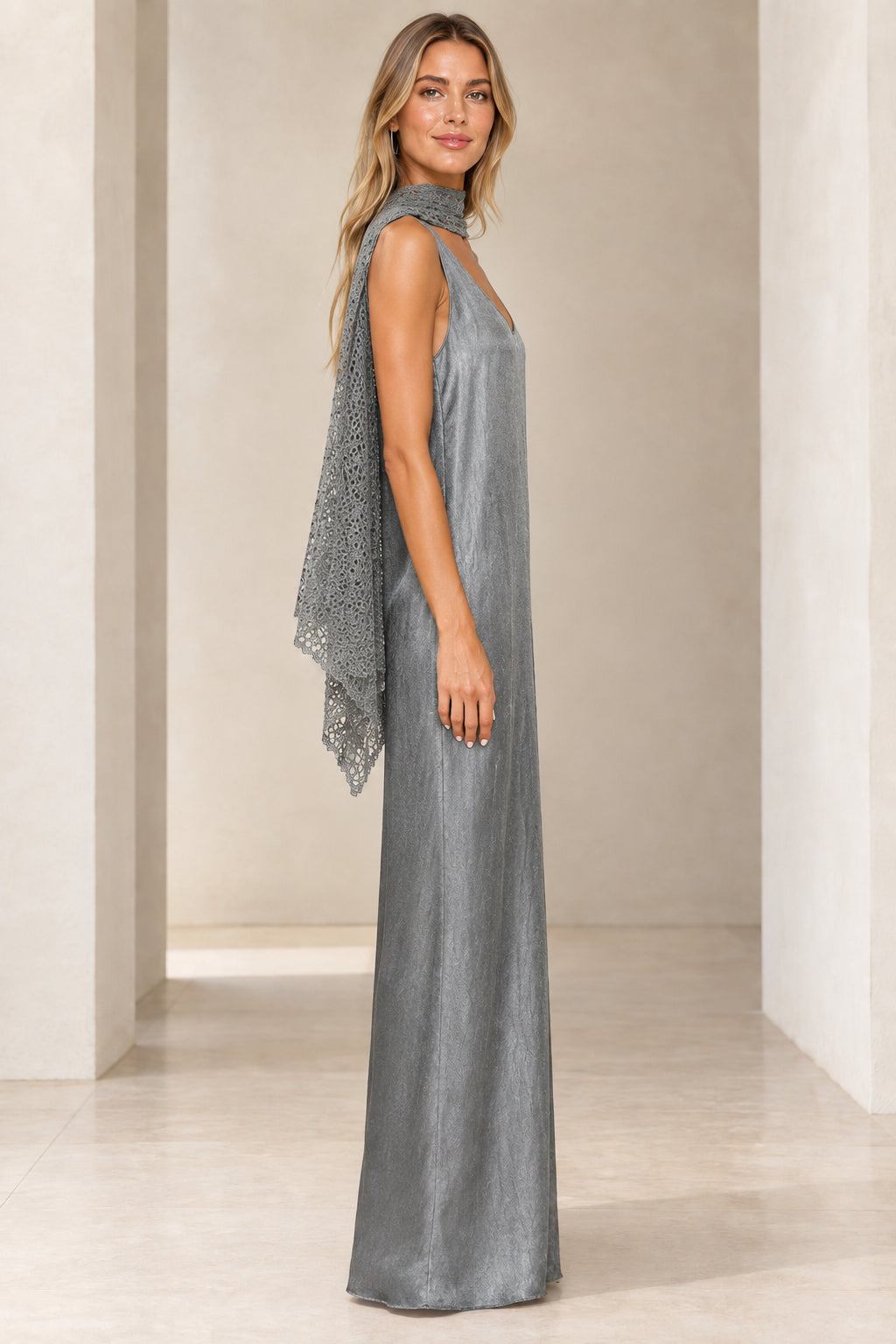 Side profile of silver shimmer sleeveless maxi dress with coordinating neck scarf