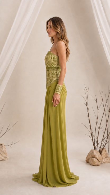 Side profile of olive green formal gown showing draped skirt and asymmetric bodice