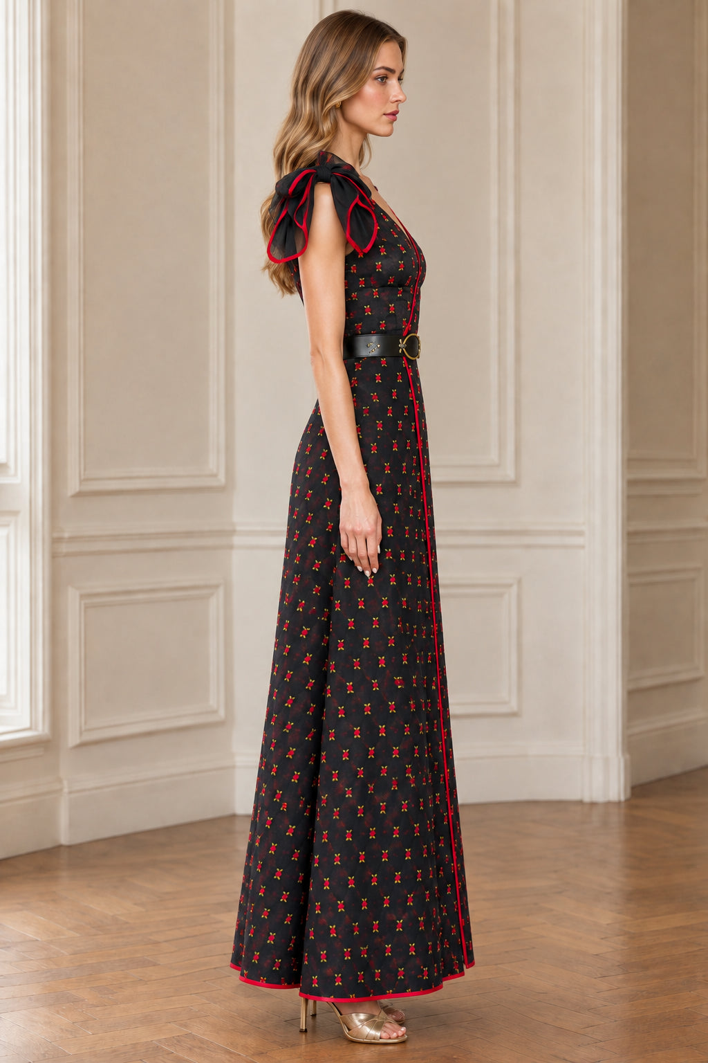 Side profile view of black floral A-line maxi dress