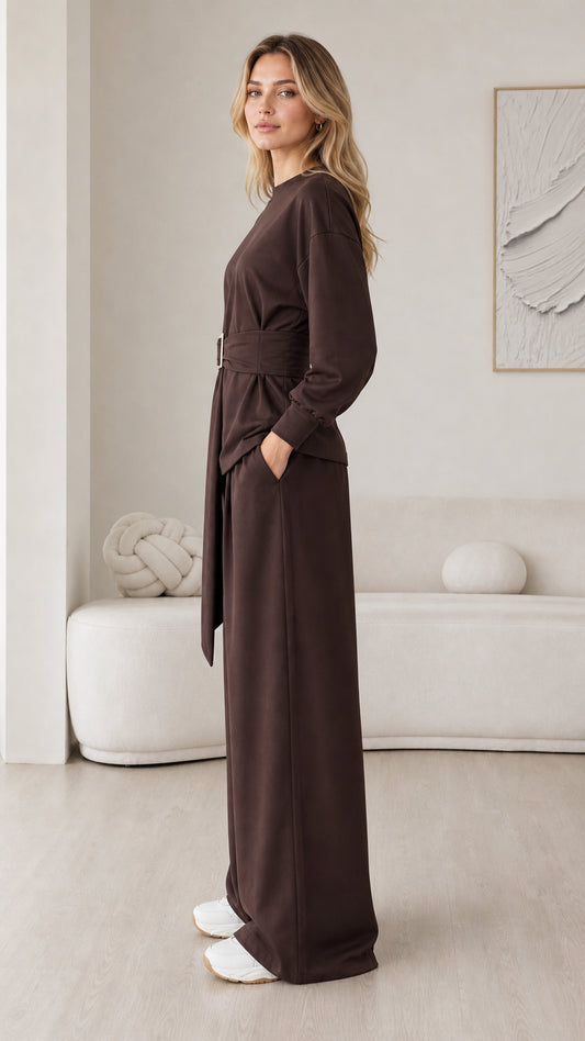Side profile view of model wearing chocolate brown belted loungewear set