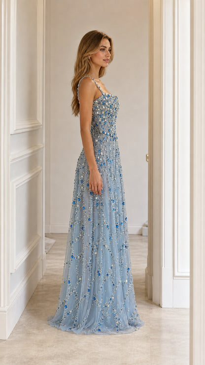 Side profile of light blue crystal embellished evening gown