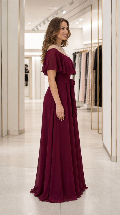 Side profile of burgundy formal maxi dress