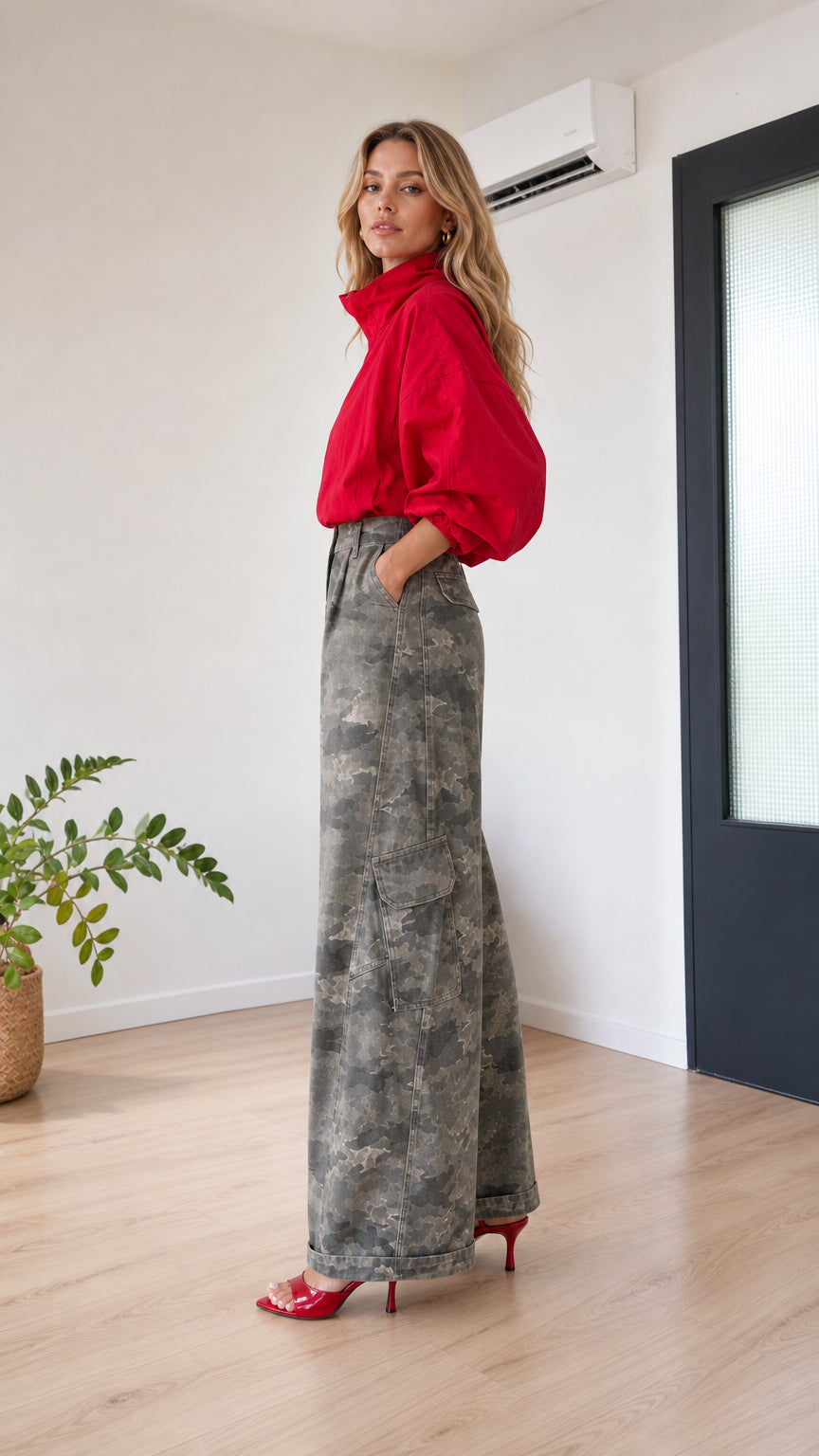 Side view of model showing wide-leg profile and side cargo pocket in grey camo
