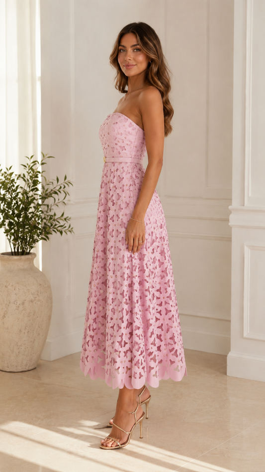 Side view of blush pink strapless fit and flare midi dress
