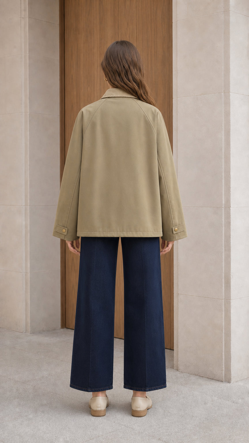Back view of woman wearing relaxed olive khaki utility jacket