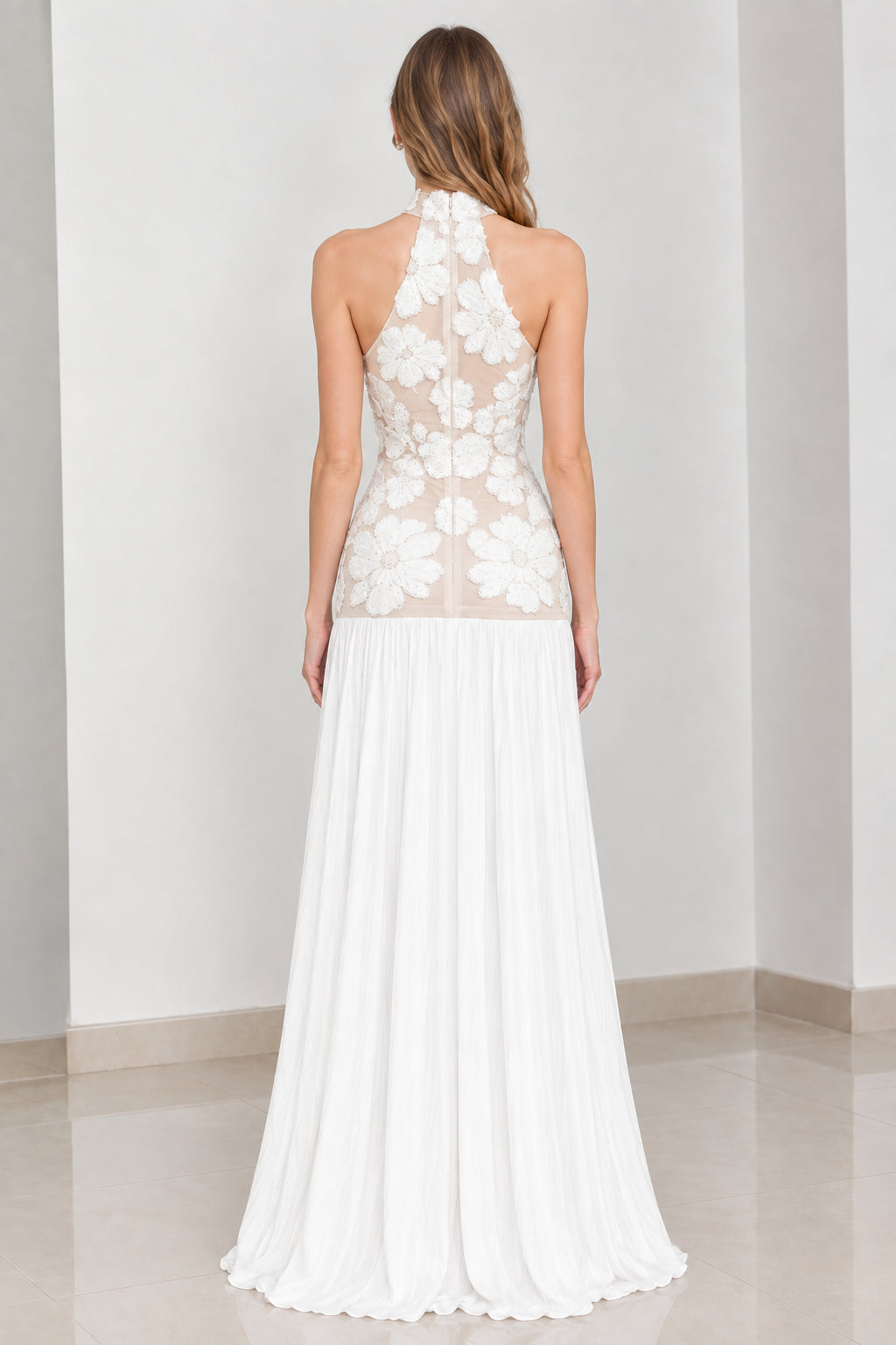Back view of white halter neck embroidered evening maxi gown