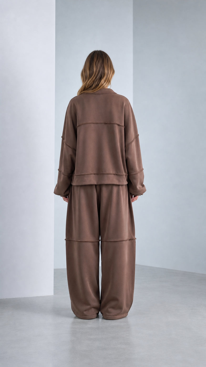 Back view of model wearing Chocolate Brown exposed seam lounge tracksuit