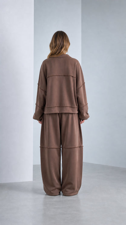 Back view of model wearing Chocolate Brown exposed seam lounge tracksuit