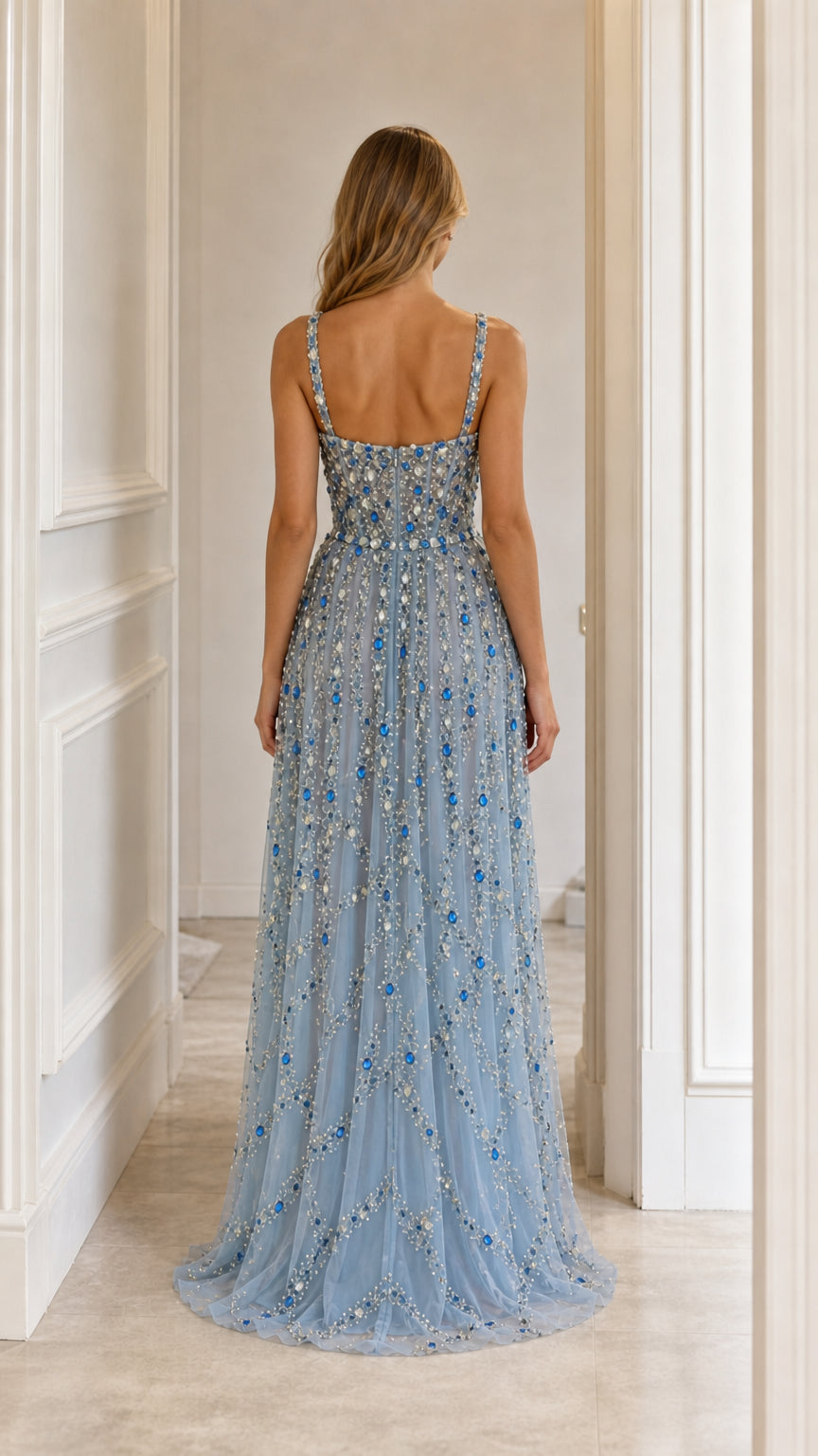 Back view of light blue crystal embellished tulle gown