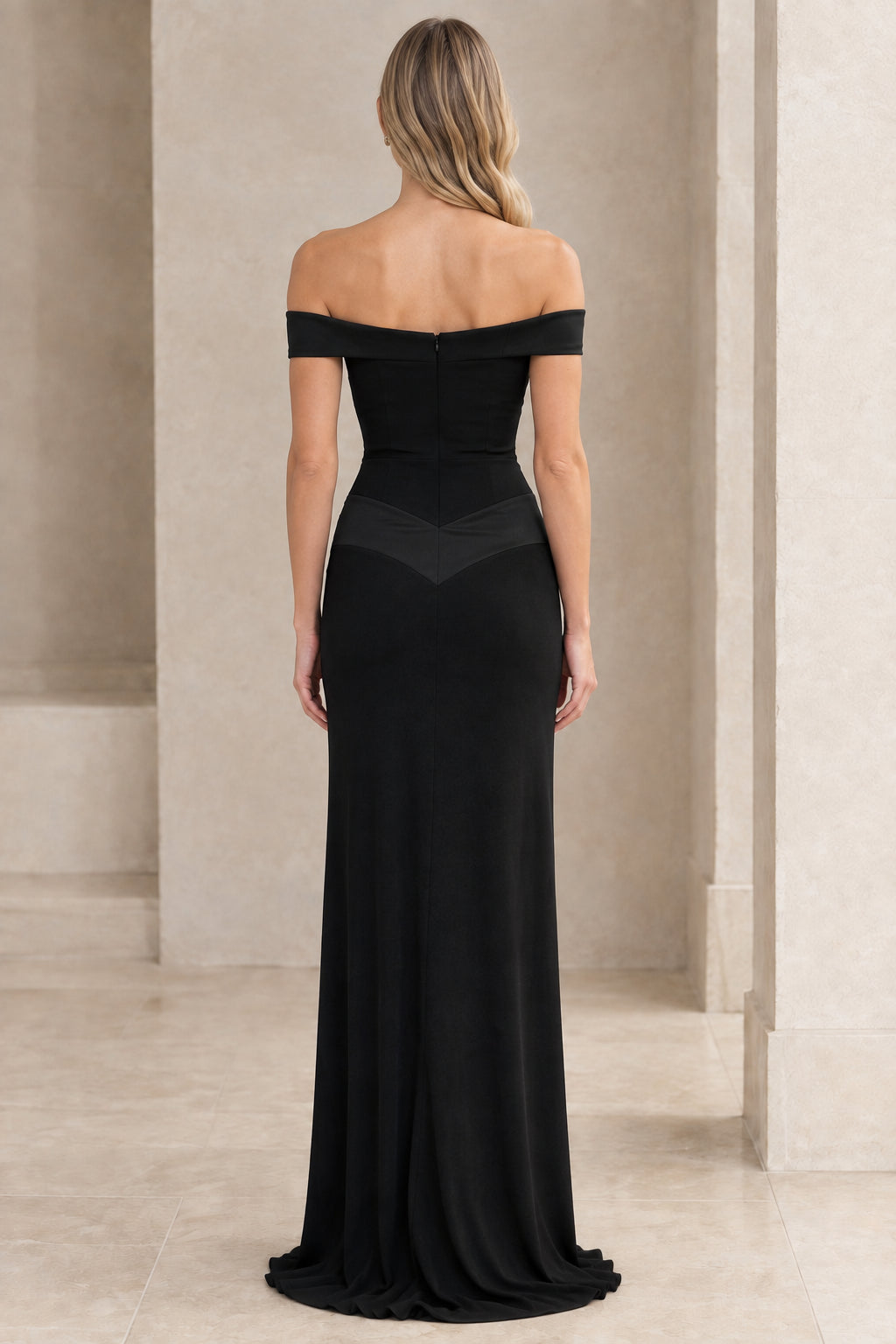 Back view of black sweetheart evening gown showing off-the-shoulder straps and back zip