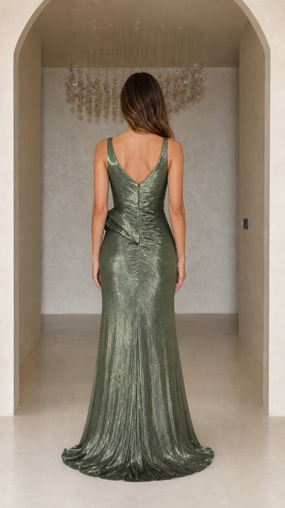 Back view of model showing the V-back cut and floor-length silhouette of the olive green gown