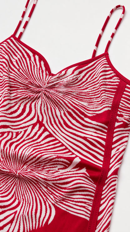 Close-up detail of the red and white pattern and strap construction