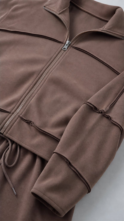 Close-up detail of Chocolate Brown zip-up jacket collar and exposed seam construction
