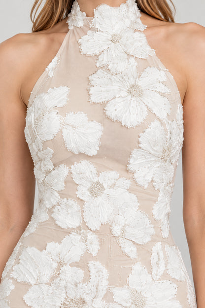 Close-up detail of high halter neckline and dimensional floral embroidery