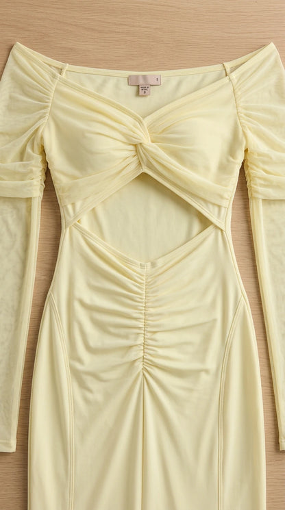 Close-up detail of butter yellow off-the-shoulder dress bodice and front cutout