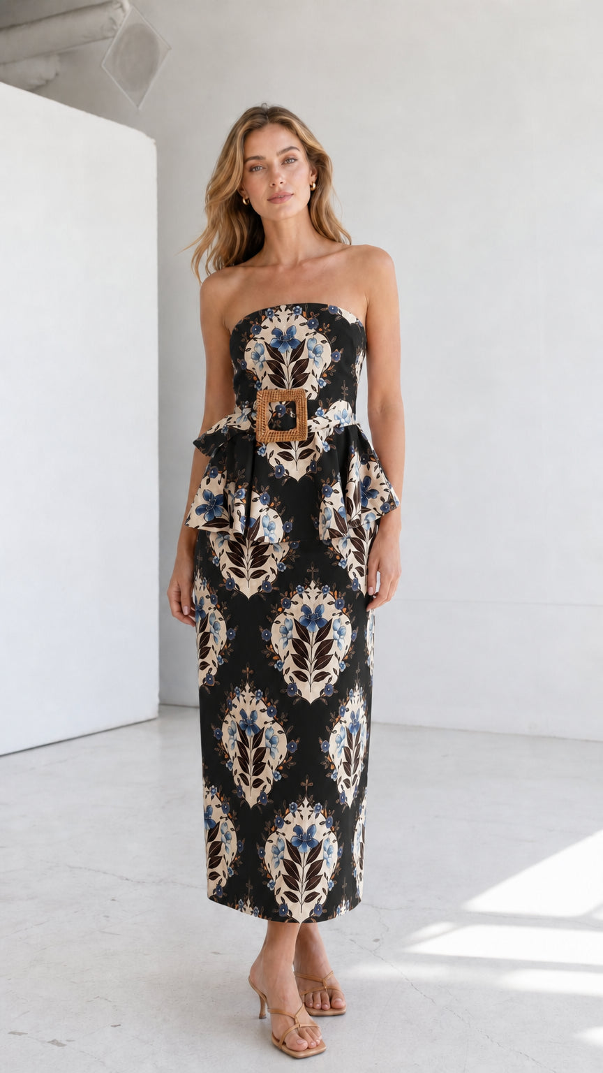 Full length view of model in black strapless floral midi dress
