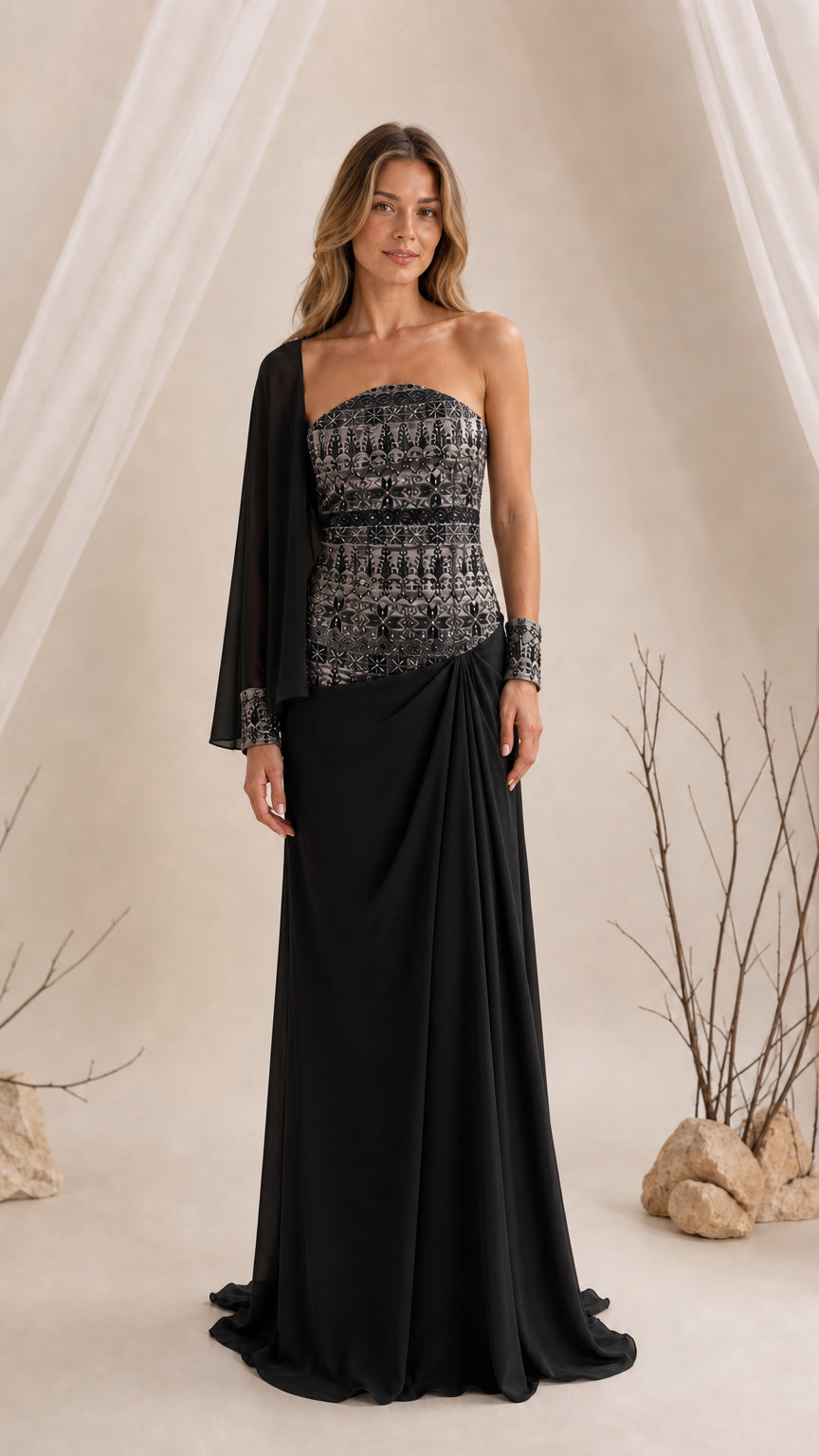 Black strapless embroidered evening gown with cape sleeve
