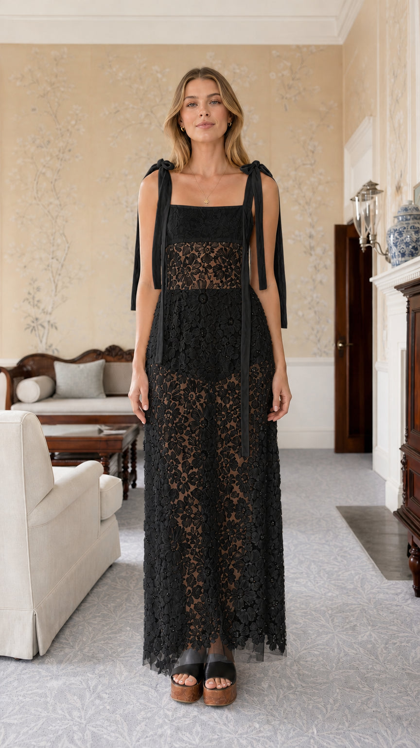 Front view of black tie-strap lace maxi dress