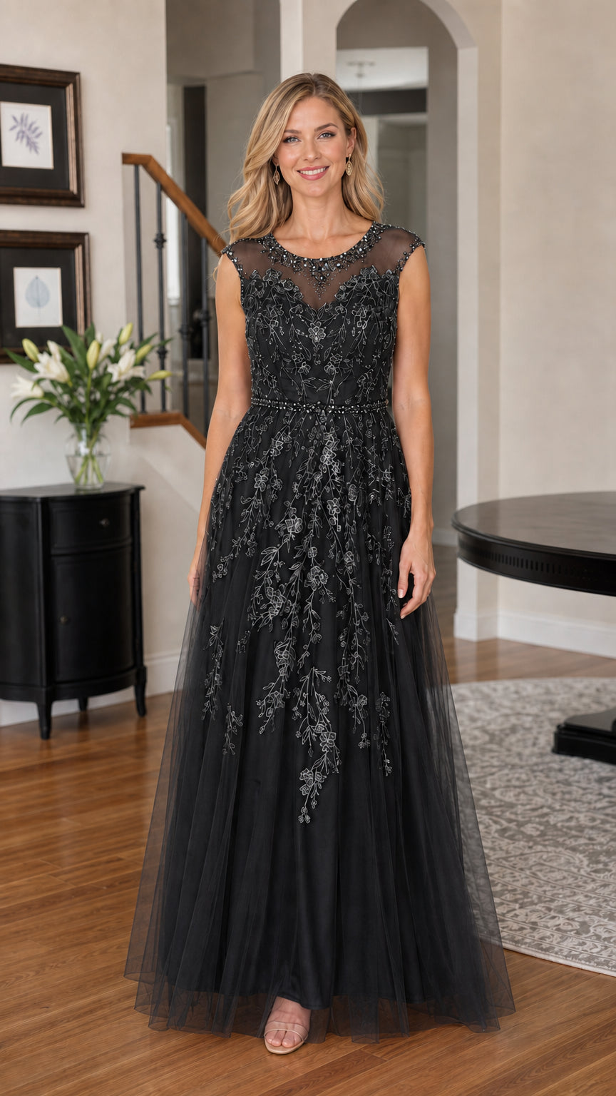 Woman wearing black embroidered tulle evening gown