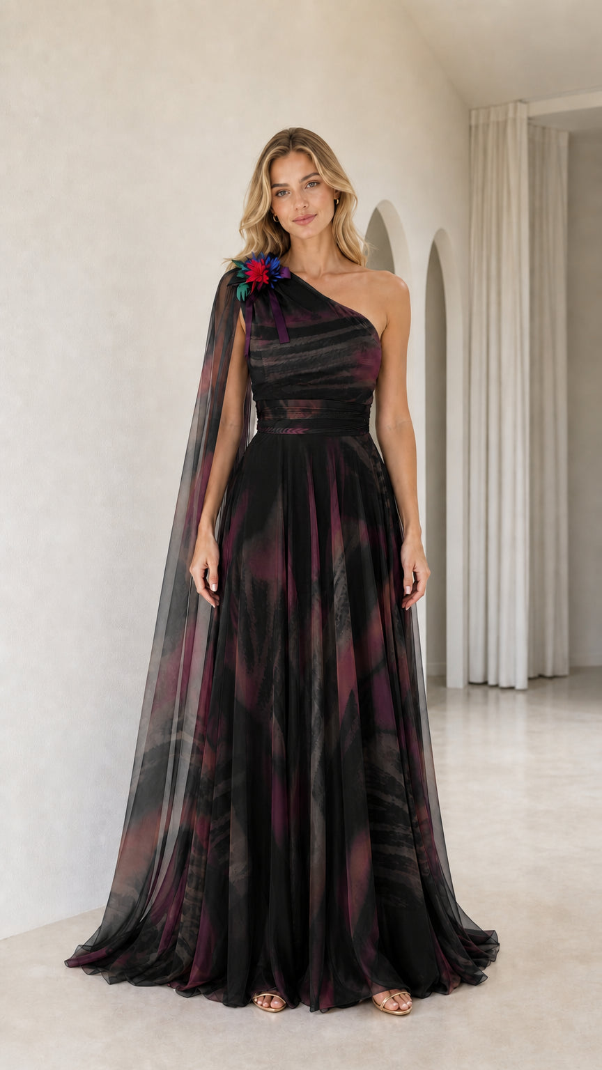 Full front view of black multi watercolor printed one-shoulder cape gown
