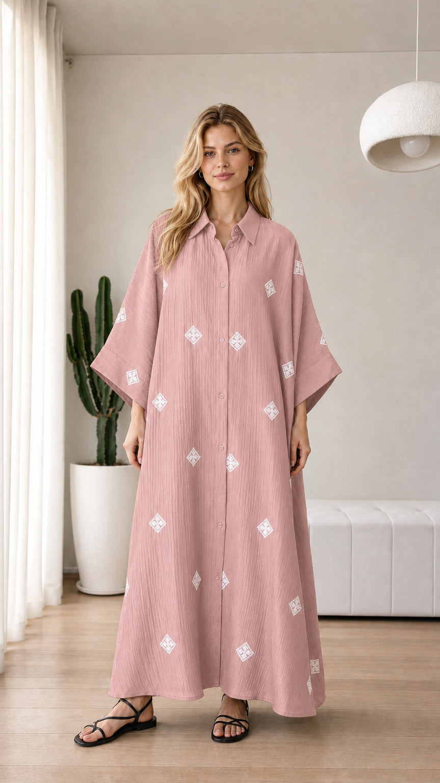 Dusty pink embroidered button-down maxi shirt dress on model