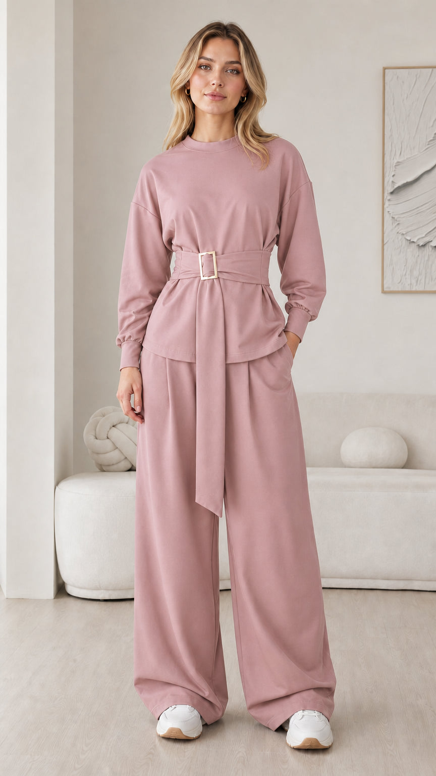 Model wearing dusty pink long sleeve belted lounge top and wide leg trousers set