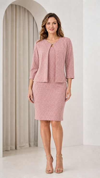 Woman wearing blush pink shimmer two-piece dress and jacket set