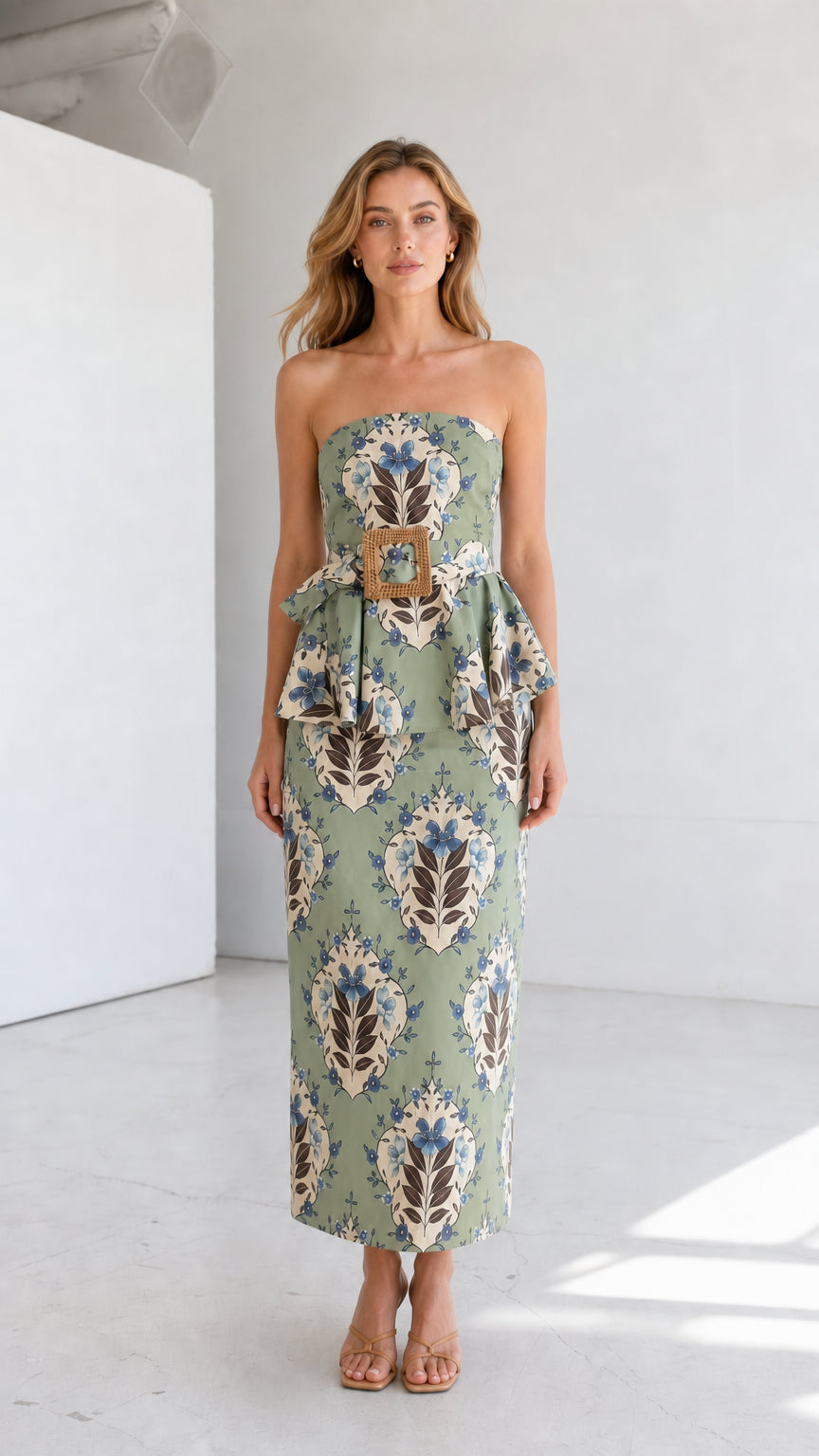 Full length view of model in sage green strapless floral midi dress