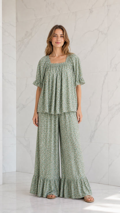 Model wearing sage green ditsy floral two-piece wide-leg pants set