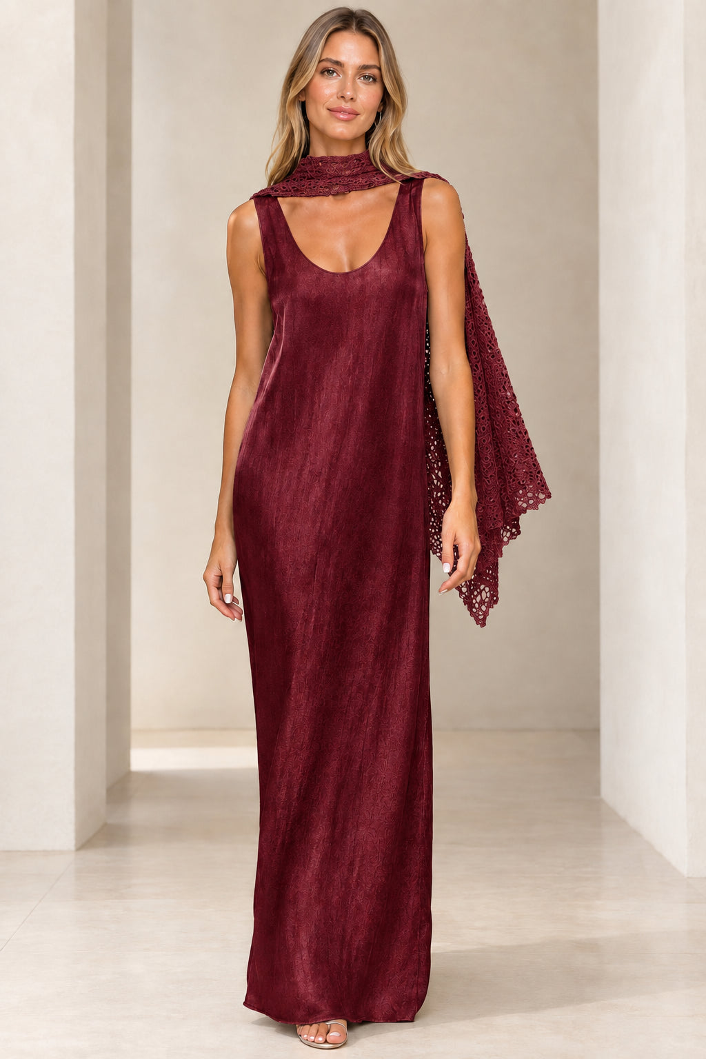 Front view of burgundy wine shimmer sleeveless maxi dress with matching red crochet scarf