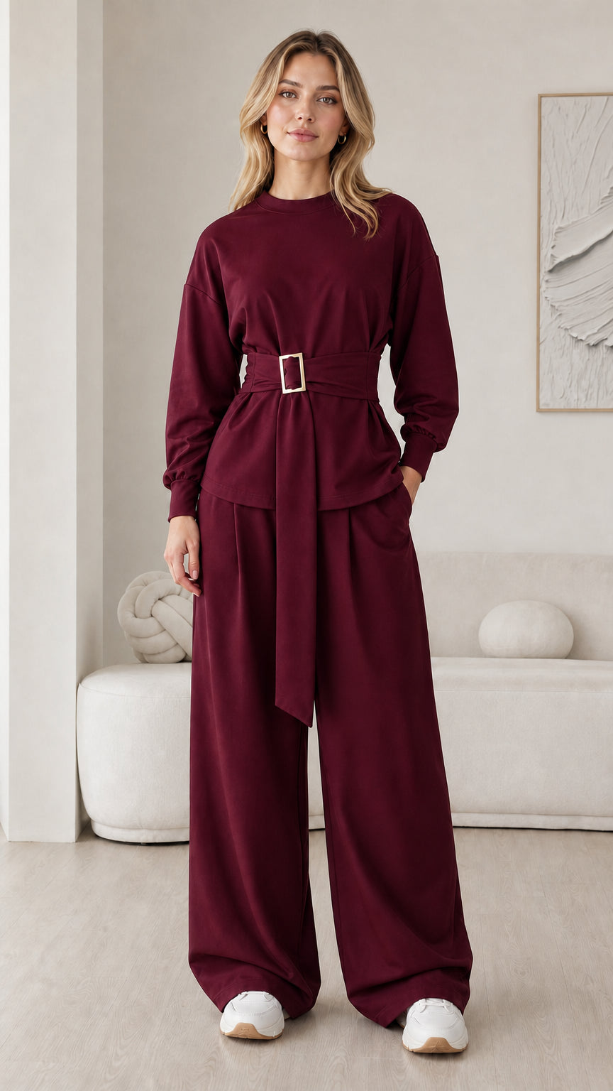Model wearing deep burgundy belted long sleeve and wide leg lounge set