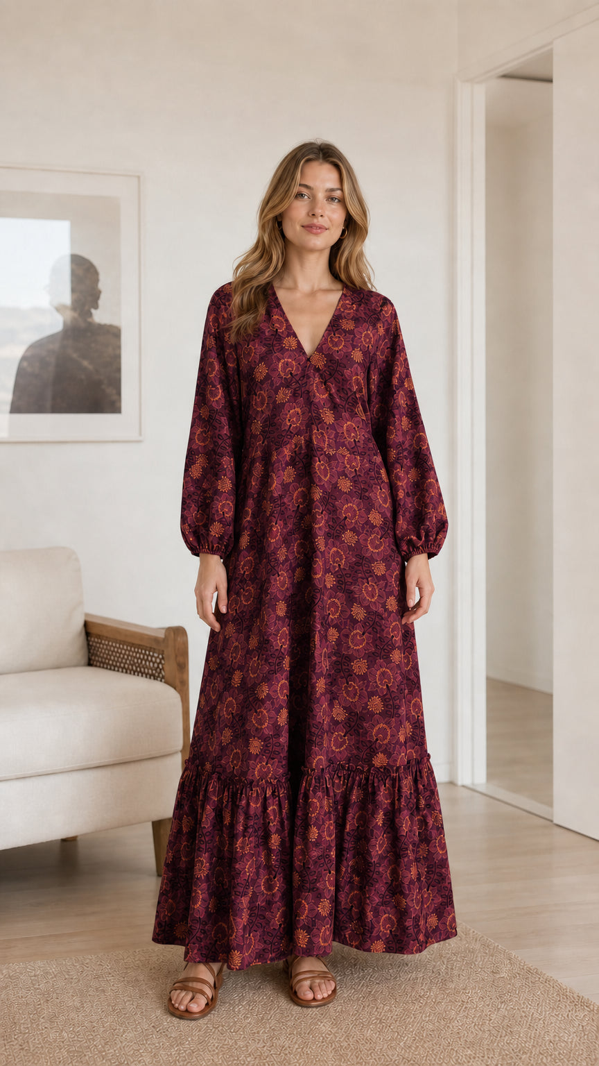Model wearing burgundy plum floral print long sleeve tiered maxi dress