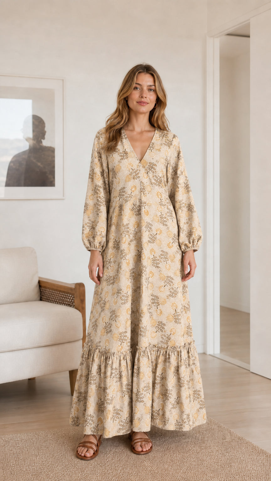 Model wearing beige cream floral print long sleeve tiered maxi dress