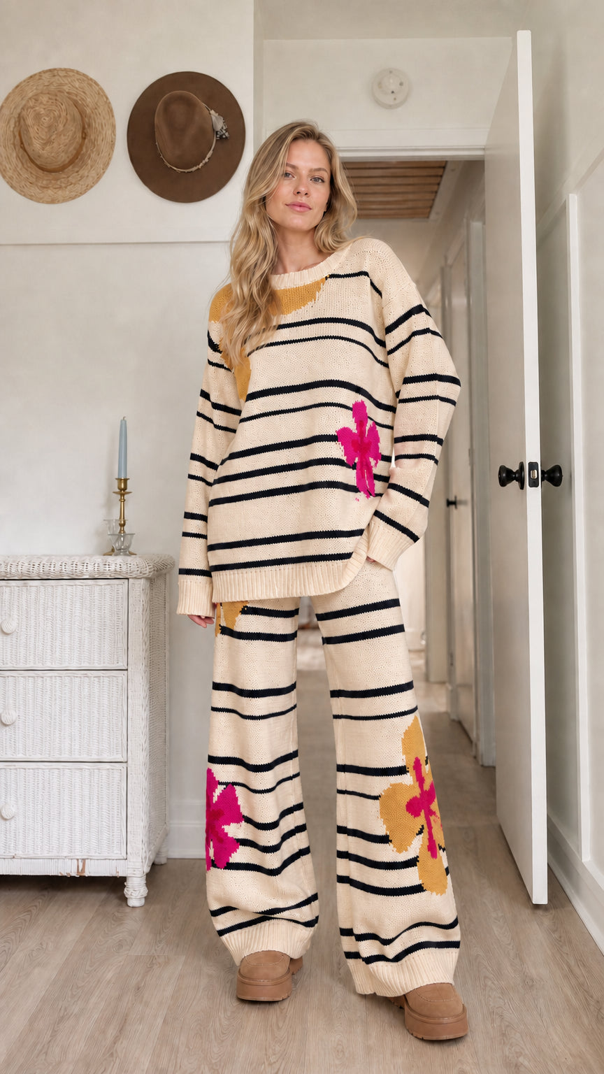 Model wearing warm beige striped knit lounge set with floral jacquard details