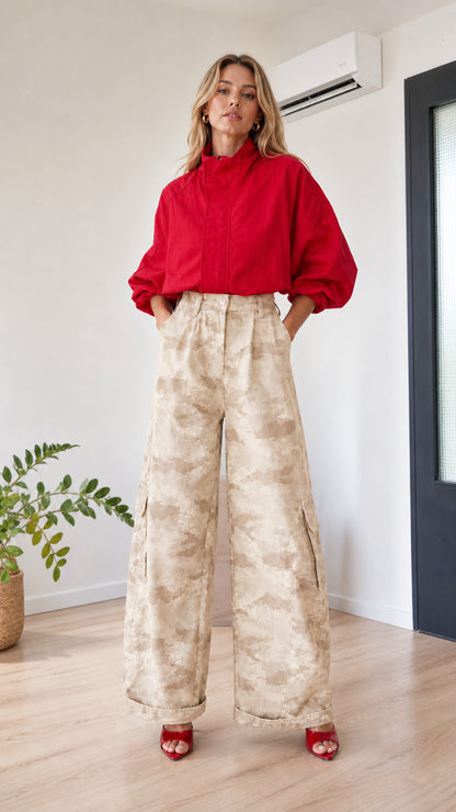 Model wearing beige khaki camo high-waisted wide-leg cargo pants with red top
