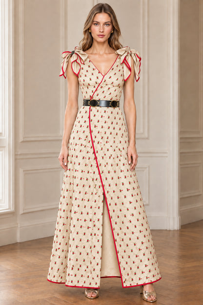 Cream floral maxi dress with red trim and bow shoulder accents