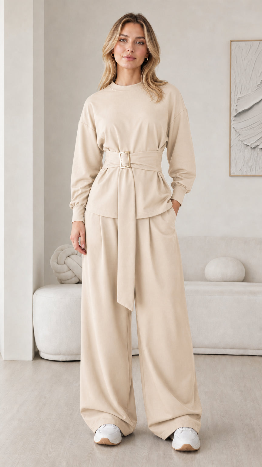 Model wearing beige oatmeal belted long sleeve top and wide leg pant set